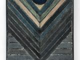 a close up of a piece of art with a blue ball on it
