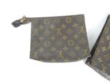 two louis vuittou wallets are sitting on a white surface