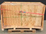 a large wooden box with a red ribbon on it