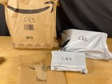 a brown paper bag sitting on top of a wooden table next to a pair of scissors and a pair of scissors