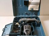 a tool box with tools inside of it on a table