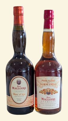 two bottles of liquor sitting next to each other on a table