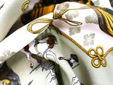 a picture of a close up of a scarf with a horse pattern