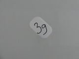 a sticker with the number 25 on it on a toilet