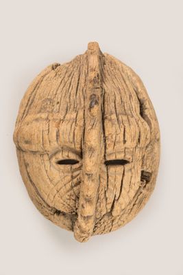an image of a walnut nut with a face carved into it