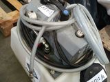 a picture of a tank with a hose attached to it