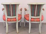 pair of antique painted chairs with upholstered arms and back cushions