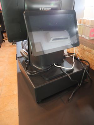 an image of a cash register machine in a store