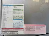 a picture of a receipt sitting on top of a refrigerator