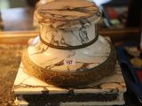 a white and black marble cake on top of a marble block