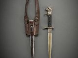 a knife and a knife holder on a table