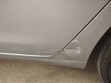 a close up of a car door with the door handle missing