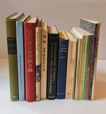 a lot of books that are stacked together on a table