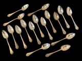 a lot of spoons and spoon spoons on a black background