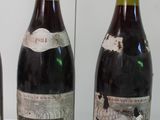 three bottles of wine sitting on a table next to each other