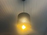 a light that is hanging from the ceiling in the room