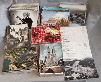 a lot of postcards sitting on a table