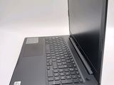 a laptop computer sitting on top of a white table