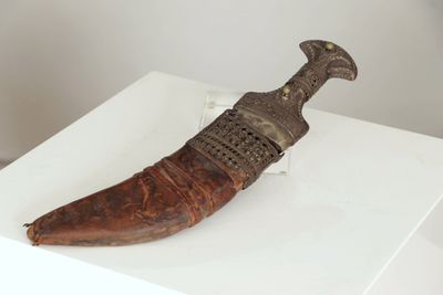 a large horn shaped object on display on a white table
