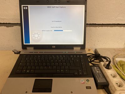 a laptop computer sitting on top of a table