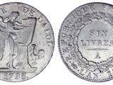 a close up of a coin with a man on it