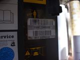 a close up of a parking meter with stickers on it