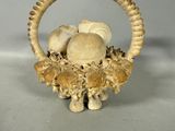 a basket with mushrooms and mushrooms in it on a table