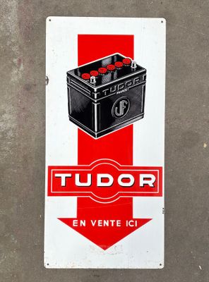a red and white sign with a picture of a car battery
