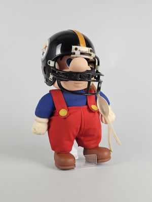 the figurine is wearing a football helmet and overalls