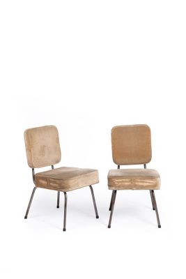 pair of mid - century chairs with upholstered backrests and metal legs