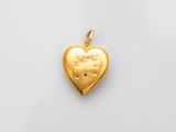 a gold heart shaped locke with a small diamond in the center