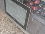 a glass display case with a television inside of it
