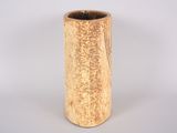 a small vase with a wooden handle on a white background