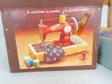 a box with a sewing machine on it sitting on a table