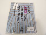 a bag of underwear on a table with a tag on it