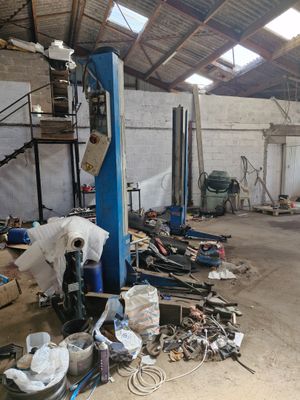 a garage with a lot of tools and tools on the floor