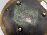 a close up of a metal object with a tag on it