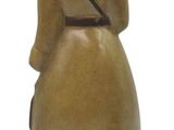 a brown vase with a woman holding a bag