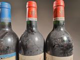 three bottles of wine sitting next to each other on a table