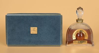 an image of a bottle of perfume sitting next to a box