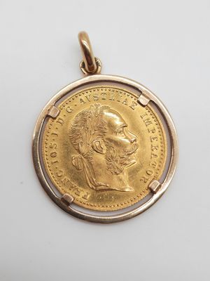 une pièce d'or « sovereign » sur laquelle figure le portrait d'un homme