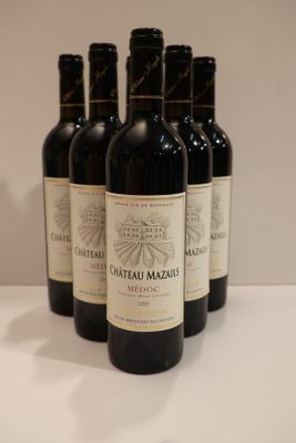 six bottles of red wine are lined up on a table