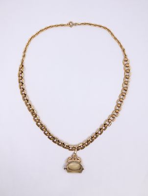 a gold necklace with a heart charm hanging from it