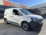 a white van parked in front of a building