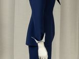 a mannequin dressed in a blue suit and white gloves