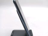 a cell phone that is sitting on top of a stand