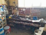 a workbench with many tools on it in a garage