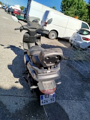 a scooter that is parked in a parking lot