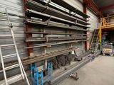 a room with a lot of shelves and ladders in it