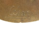 an image of a close up of a metal object with writing on it